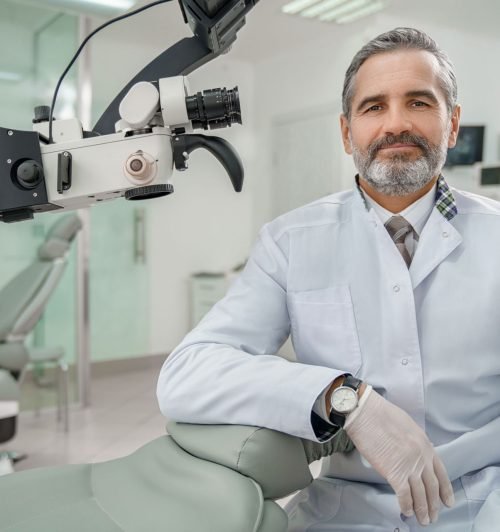 professional-male-dentist-looking-at-camera-and-sm-2023-11-27-05-31-23-utc.jpg
